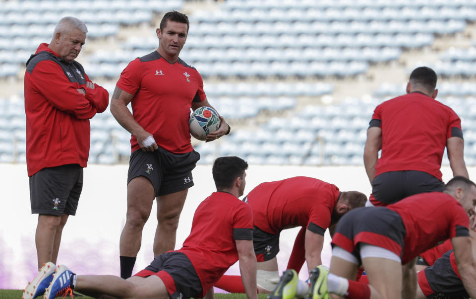 FILE - Wales rugby team head coach Warren Gatland, left, watches during training at the Prince Chichibu Memorial Rugby Ground in Tokyo, Japan, on Oct. 23, 2019. Gatland is convinced his Wales team will pull off “something special” at the Rugby World Cup. Finding any evidence to back up that bold assertion isn’t easy. (AP Photo/Aaron Favila, File)
