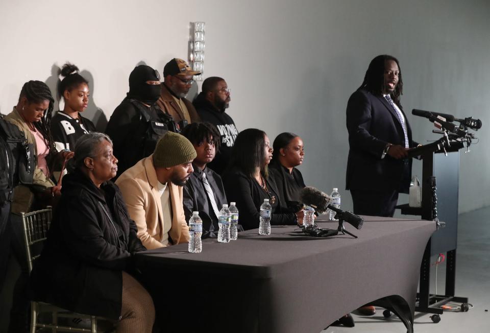 Tavion Koonce-Williams, the 15-year-old boy who was shot by an Akron police officer April 1, appears with his parents James Koonce and Angel Williams and other family members and supporters as they listen to his attorney, Imokhai Okolo address the media during a press conference at 8 Point Hall in Akron on Friday, April 12, 2024.