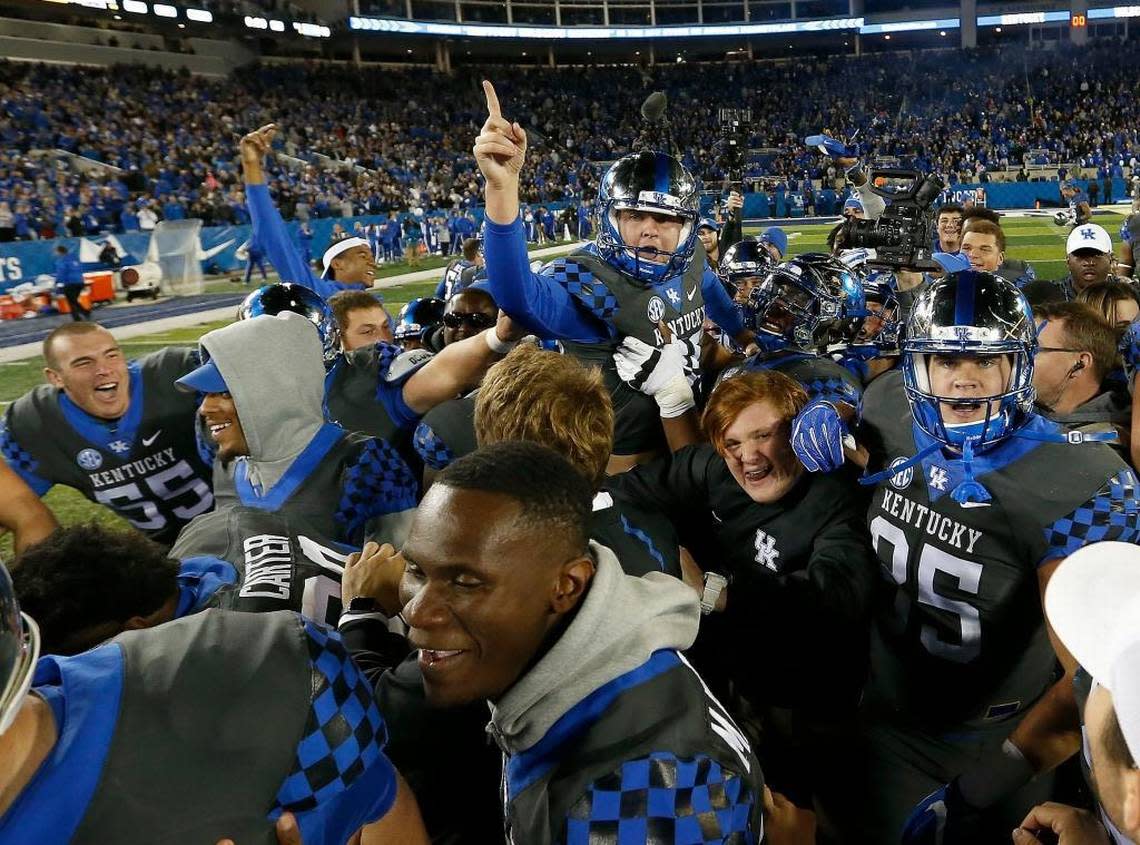 Place-kicker Austin MacGinnis (99) was given a ride on the shoulders of his teammates after he kicked a 51-yard, game-winning field goal just ahead of the final buzzer in UK’s 40-38 2016 victory over Mississippi State.