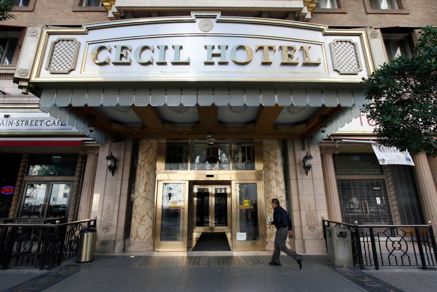 A visitor arrives at the hotel Cecil on Wednesday Feb. 20,2013 where police say the body of a woman was found wedged in one of the water tanks on the roof was that of a missing Canadian guest. Investigators used body markings to identify 21-year-old Elisa Lam, police spokeswoman Officer Diana Figueroa said late Tuesday. A maintenance worker at the Cecil Hotel found the body earlier in the day after guests complained of low water pressure.