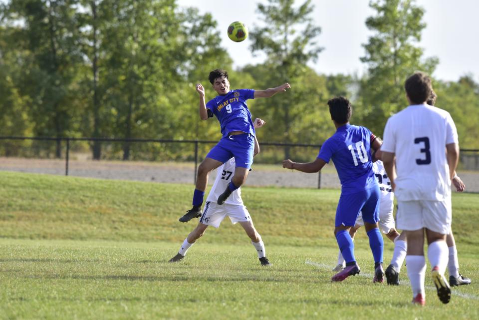 Imlay City's Jose Salcedo headers a corner kick during a game earlier this season. The Spartans will face Macomb Lutheran North in a Division 3 district final on Thursday.