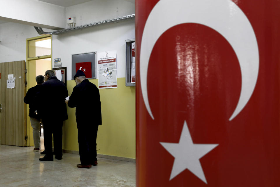 Voters wait in the line for cast their ballots at a polling station during the local elections in Ankara, Turkey, Sunday, March 31, 2019. Turkish citizens have begun casting votes in municipal elections for mayors, local assembly representatives and neighborhood or village administrators that are seen as a barometer of Erdogan's popularity amid a sharp economic downturn. (AP Photo/Ali Unal)