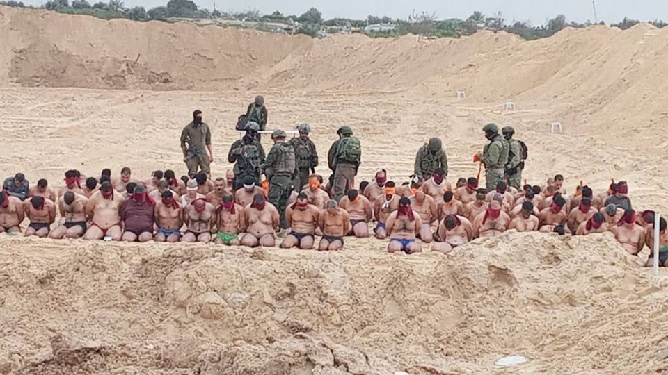 Images from Gaza circulating on social media showed a mass detention by the Israeli military of men who were made to strip to their underwear, kneel on the street, wear blindfolds, and pack into the cargo bed of a military vehicle. - Obtained by CNN
