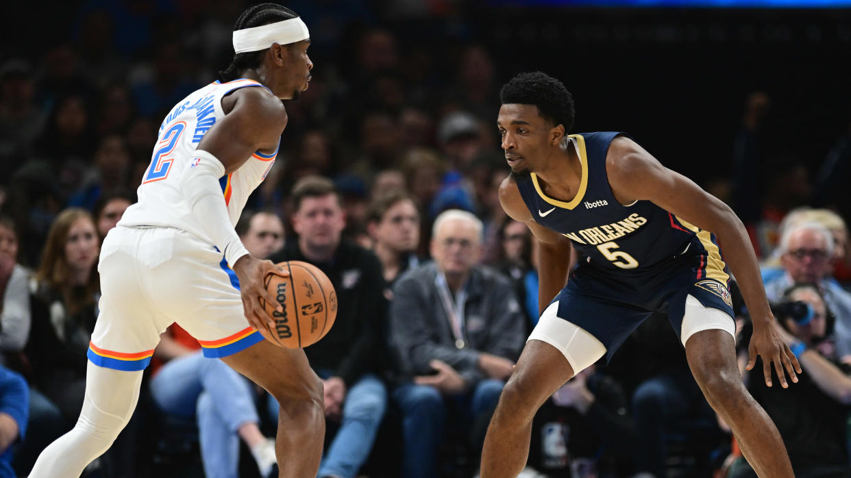 OKLAHOMA CITY, OKLAHOMA - NOVEMBER 1: Herbert Jones #5 of the New Orleans Pelicans plays defense against Shai Gilgeous-Alexander #2 of the Oklahoma City Thunder during the first half at Paycom Center on November 1, 2023 in Oklahoma City, Oklahoma. NOTE TO USER: User expressly acknowledges and agrees that, by downloading and or using this photograph, User is consenting to the terms and conditions of the Getty Images License Agreement. (Photo by Joshua Gateley/Getty Images)