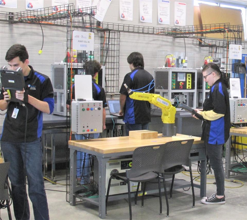 Robotics students work in the RAMTEC lab during morning classes at WCSCC.