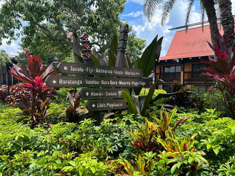 Signs pointing to different parts of Disney's Polynesian Resort.