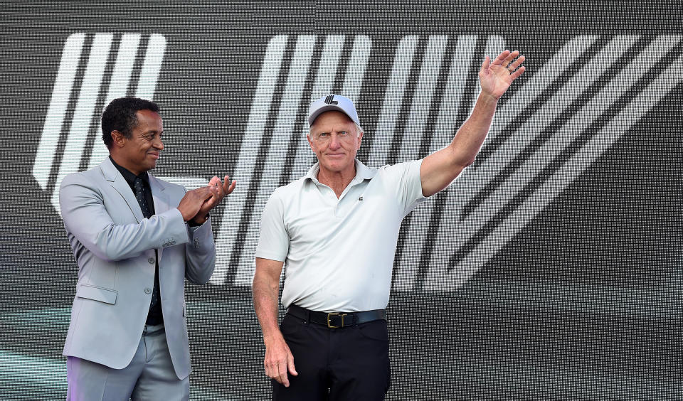 Managing Director of LIV Golf Majed Al Sorour (pictured left) and Greg Norman (pictured right) acknowledge the crowd during a LIV Golf Invitational.