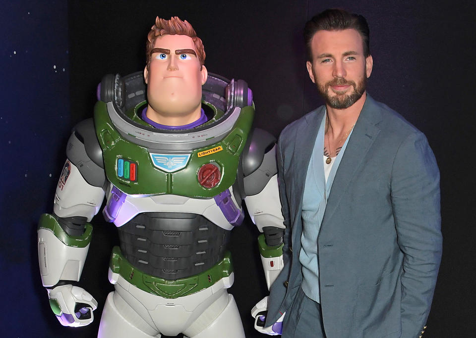 Chris Evans (R) poses with Buzz Lightyear at the UK Premiere of "Lightyear" at Cineworld Leicester Square