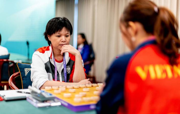 Singapore xiangqi player Ngo Lan Huong competing against Vietnam's Nguyen Thi Phi Liem in the women's individual event at the 2023 Hangzhou Asian Games. (PHOTO: SNOC/Kelly Wong)