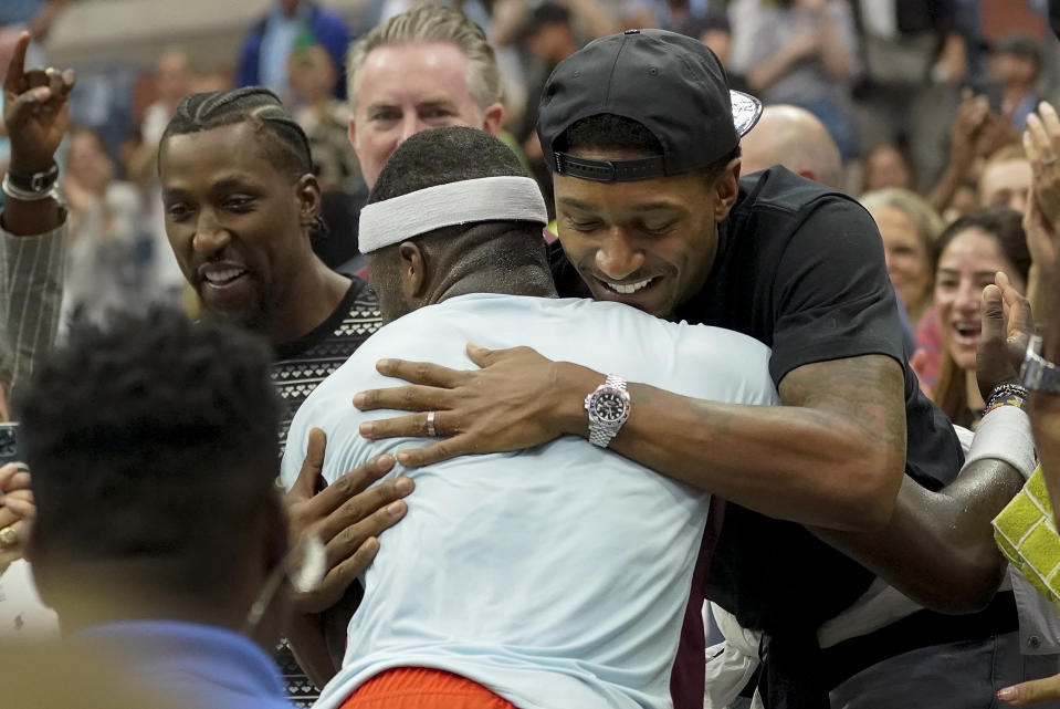 Washington Wizards guard Bradley Beal, right, hugs Frances Tiafoe, of the United States, after Tiafoe defeated Andrey Rublev, of Russia, during the quarterfinals of the U.S. Open tennis championships, Wednesday, Sept. 7, 2022, in New York. (AP Photo/Mary Altaffer)