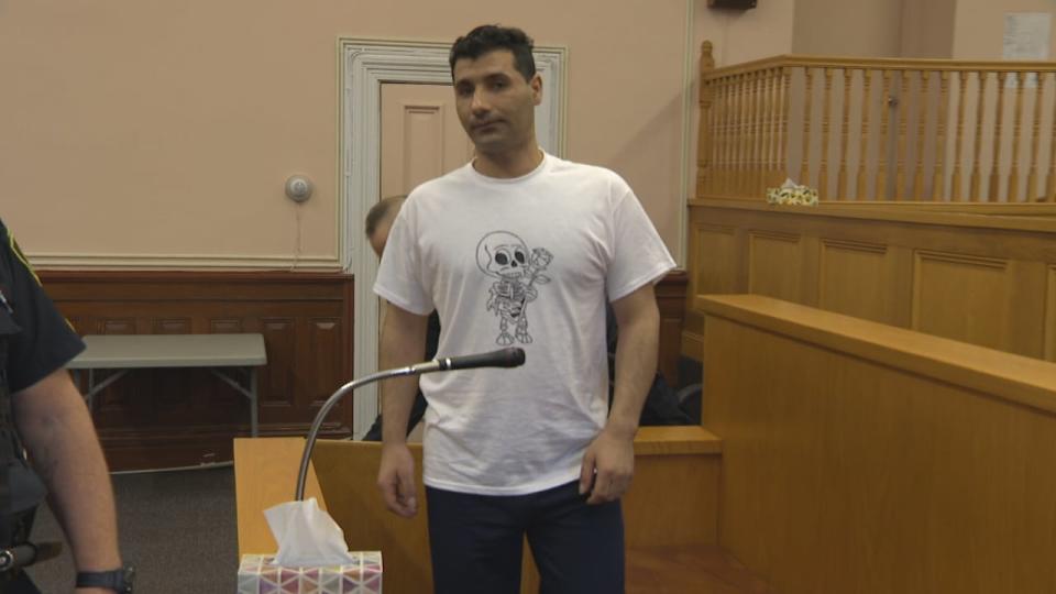 Ibrahim Alahmad appeared in court in St. John's on Monday wearing a white t-shirt. On the front of the shirt was a caricature of a human skeleton, carrying a rose.