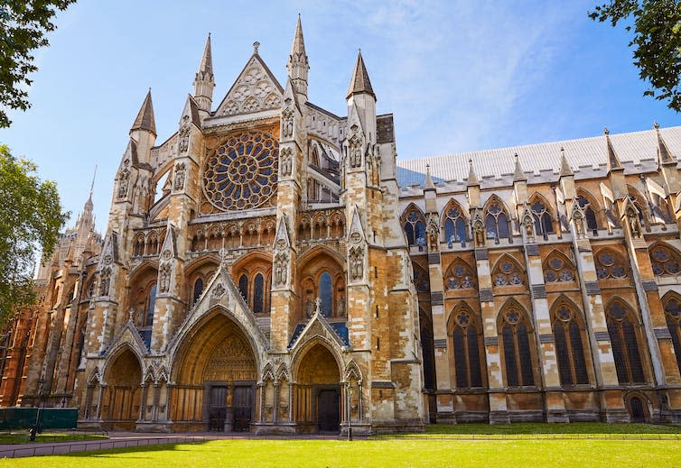 The imposing building of Westminster Abbey in the sunshine.