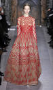 <b>Valentino SS13 </b><br><br>Red was another key trend on the couture catwalk, with this dress featuring a nude gown underneath with red patterned overlay.<br><br>© Rex