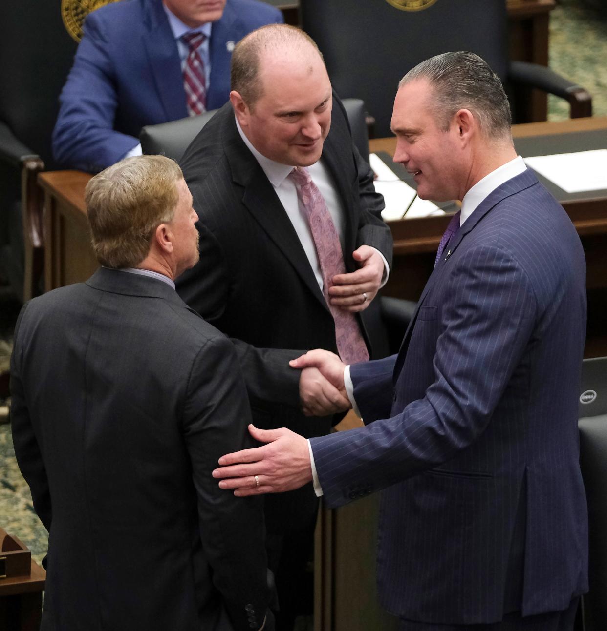 House Speaker Charles McCall, right, greets Rusty Cornwell, left, and Jon Echols, majority floor leader, on Feb. 7 during the second day of the 2023 session in the Oklahoma House of Representatives.