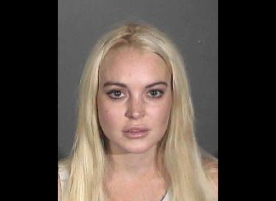 In this booking photo provided by the Los Angeles County Sheriff's Department, Lindsay Lohan is seen in a mug shot October 19, 2011 in Los Angeles, California. Lohan was arrested for probation violations and released after posting USD 100,000 bail.  (Getty)