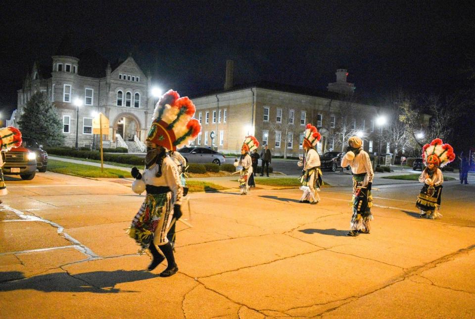 Danza Guadalupana dancers perform in front of the courthouse. Roberto Martinez, a member of the group, described the dance as praying “with our feet.”
