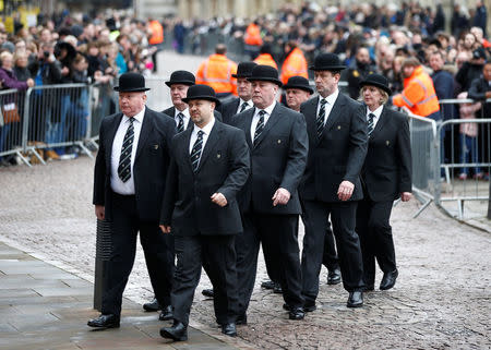 University of Cambridge college porters arrive at Great St Marys Church, where the funeral of theoretical physicist Prof Stephen Hawking is being held, in Cambridge, Britain, March 31, 2018. REUTERS/Henry Nicholls