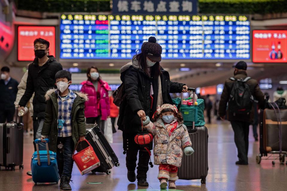 A family travels back home for the Lunar New Year holidays (AFP via Getty Images)
