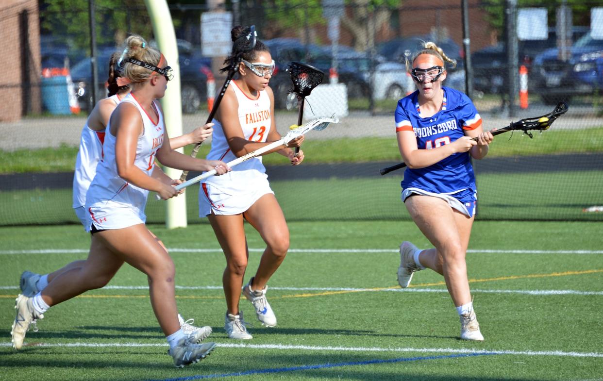 Boonsboro senior Kerrigan Chriest, right, is chased by a trio of Fallston defenders during a Class 1A state semifinal at Havre de Grace High School on May 21. Fallston defeated Boonsboro, 16-0.