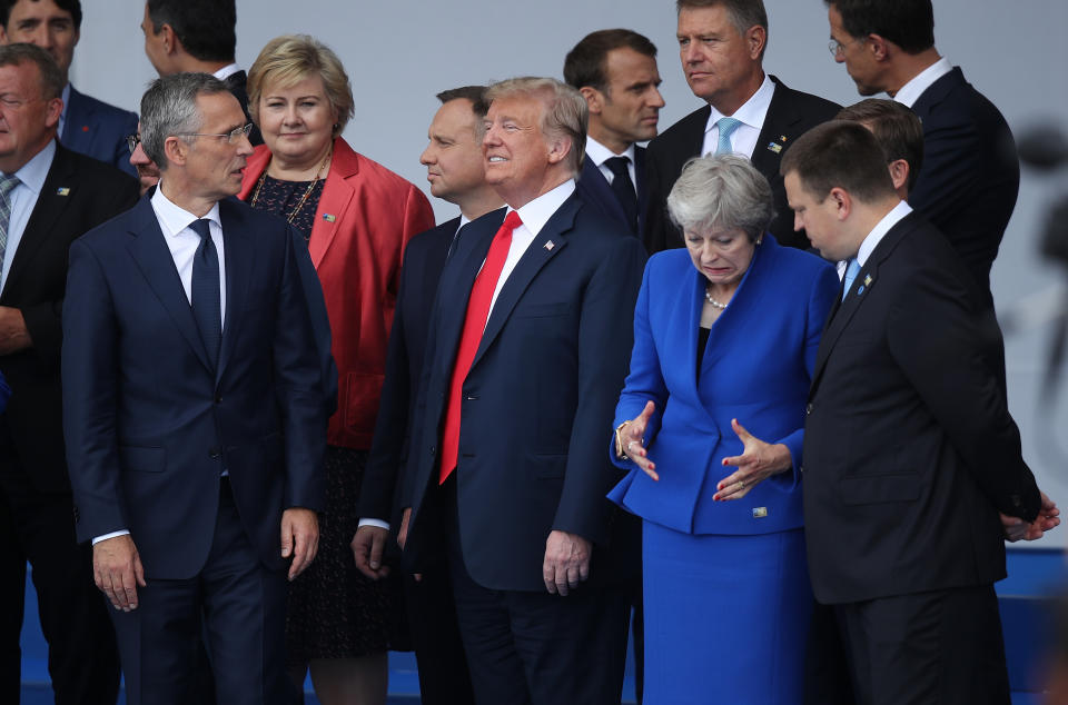 <p>Front row from left: NATO Secretary-General Jens Stoltenberg, President Trump and British Prime Minister Theresa May attend the opening ceremony at the 2018 NATO summit on July 11, 2018, in Brussels. (Photo: Sean Gallup/Getty Images) </p>