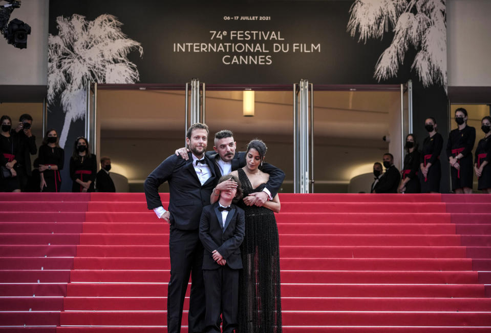 FILE - In this July 16, 2021 file photo Director Joachim Lafosse, from left, Gabriel Merz Chammah, Leila Bekhti and Damien Bonnard pose for photographers upon arrival at the premiere of the film 'The Restless' at the 74th international film festival, Cannes, southern France. (AP Photo/Vadim Ghirda, File)