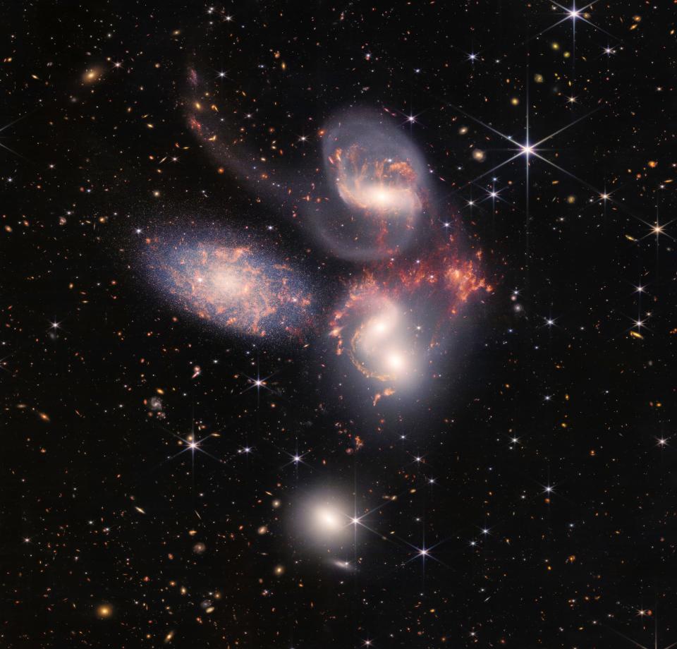 Stephan’s Quintet five spiral galaxies close together high resolution with individual stars visible