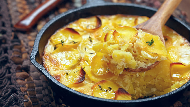 Scalloped potatoes in iron skillet