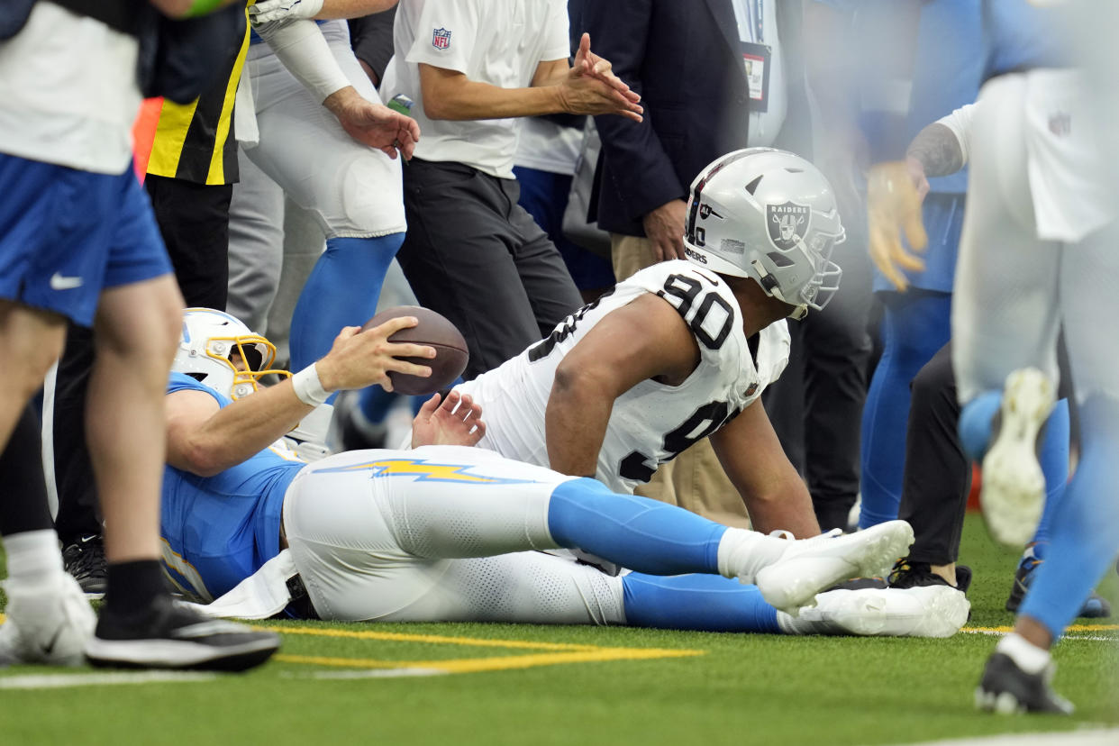 Justin Herbert led the Chargers to a touchdown after a brutal late hit. (AP Photo/Ashley Landis)