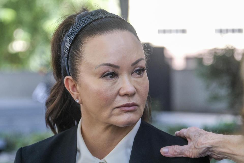 FILE - Alana Gee, the widow of a former University of Southern California football player suing the NCAA for failing to protect her husband from repetitive head trauma, leaves the Stanley Mosk civil courthouse of Los Angeles Superior Court on Oct. 21, 2022. A Los Angeles jury has rejected a claim by the widow of a former USC football player who said the NCAA failed to protect him from repeated head trauma that led to his death. The jury found Tuesday, Nov. 22, 2022, that the NCAA was not negligent in the death of Matthew Gee. (AP Photo/Ringo H.W. Chiu, File)