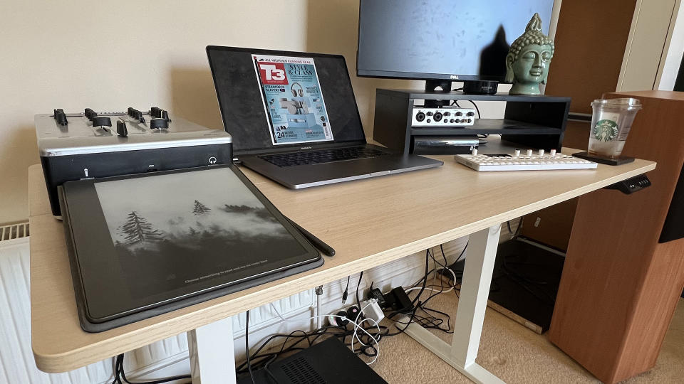 An image of the VonHaus Standing Desk with multiple different gadgets on it