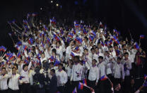 Philippine delegates wave flags during the opening ceremony of the 30th South East Asian Games at the Philippine Arena, Bulacan province, northern Philippines on Saturday, Nov. 30, 2019. (AP Photo/Aaron Favila)