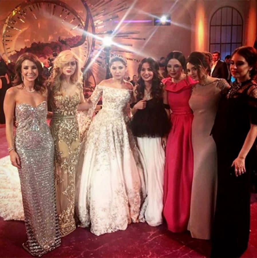 The bride poses with guests. Photo: Instagram