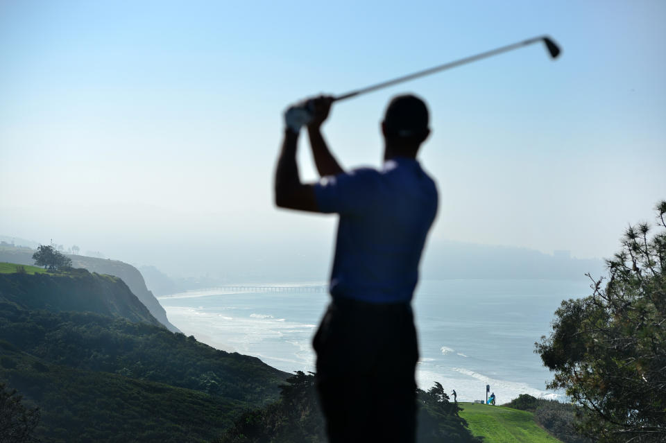 Tiger Woods plays his shot from the 15th tee during the first round of the Farmers Insurance Open at Torrey Pines North on January 23, 2020, in San Diego, California.