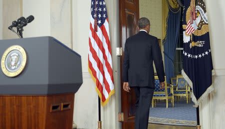 U.S. President Barack Obama departs after delivering a live televised address to the nation on his plans for military action against the Islamic State, from the Cross Hall of the White House in Washington September 10, 2014. REUTERS/Saul Loeb/Pool