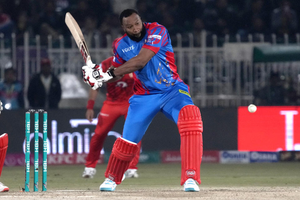 Karachi Kings' Kieron Pollard plays a shot during the Pakistan Super League T20 cricket match between Islamabad United and Karachi Kings, in Rawalpindi, Pakistan, Thursday, March 7, 2024. (AP Photo/Anjum Naveed)