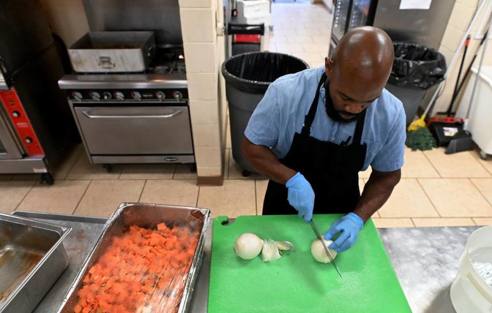 Chris Parker, one of three cooks at the Salvation Army in Bradenton, works on preparing meals and prepping turkeys for Thanksgiving in 2022.