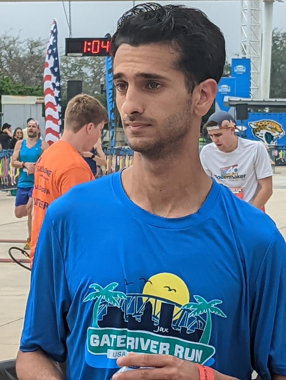 Nathan Jubran speaks with reporters after his finish at the Gate River Run. [Clayton Freeman/Florida Times-Union]