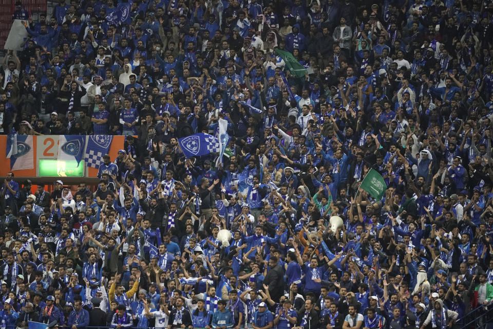 Al Hilal supporters cheer during the second leg of the AFC Champions League final soccer match between Urawa Reds and Al Hilal in Saitama, near Tokyo, Sunday, Nov. 24, 2019. (AP Photo/Christopher Jue)