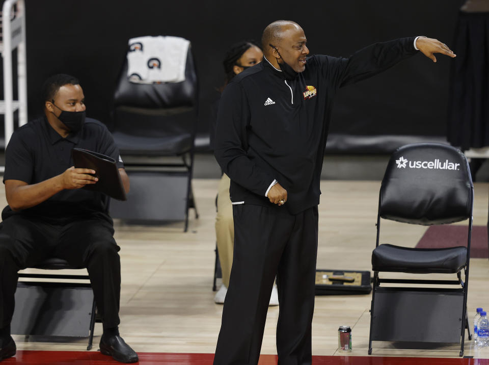 Arkansas-Pine Bluff head coach George Ivory, center, directs his team against Iowa State during the first half half of an NCAA college basketball game, Sunday, Nov. 29, 2020, in Ames, Iowa. (AP Photo/Matthew Putney)