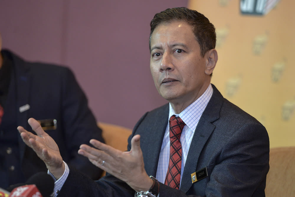 Election Commission chairman Azhar Azizan Harun speaks to the media during a press conference at Putrajaya International Convention Centre (PICC) in Putrajaya July 18, 2019. — Picture by Shafwan Zaidon