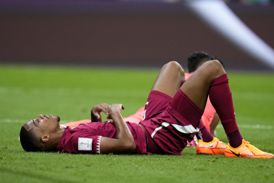 Qatar's Pedro Miguel lies during a World Cup group A soccer match against Ecuador at the Al Bayt Stadium in Al Khor , Qatar, Sunday, Nov. 20, 2022. (AP Photo/Manu Fernandez)