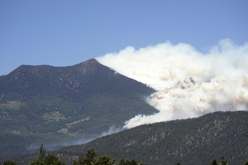 The Pipeline Fire burns on the right slope of the San Francisco Peaks about six miles north of Flagstaff. The fire is burning west of Schultz Pass and authorities have started evacuations in the area.