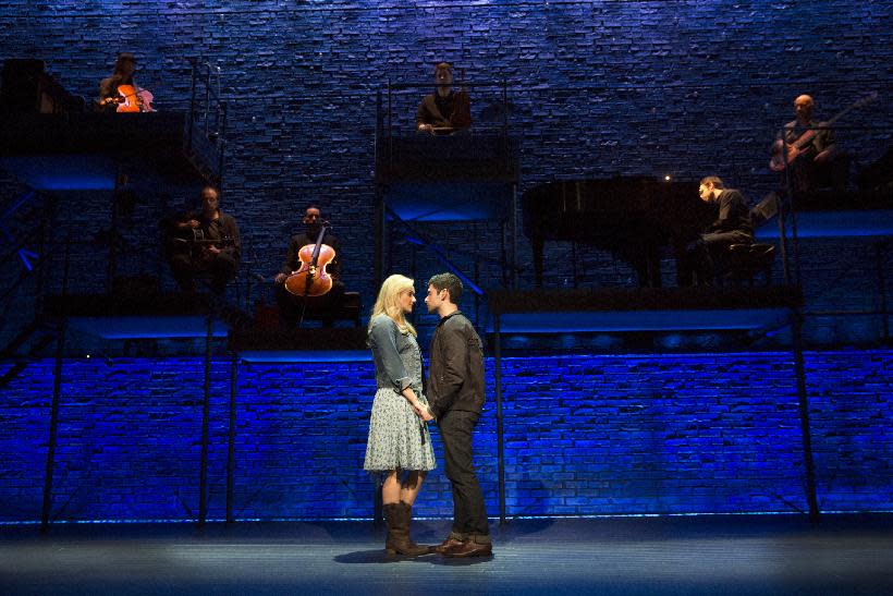 This theater image released by The Hartman group shows Adam Kantor, right, and Betsy Wolfe during a performance of "The Last Five Years," in New York. (AP Photo/The Hartman Group, Joan Marcus)