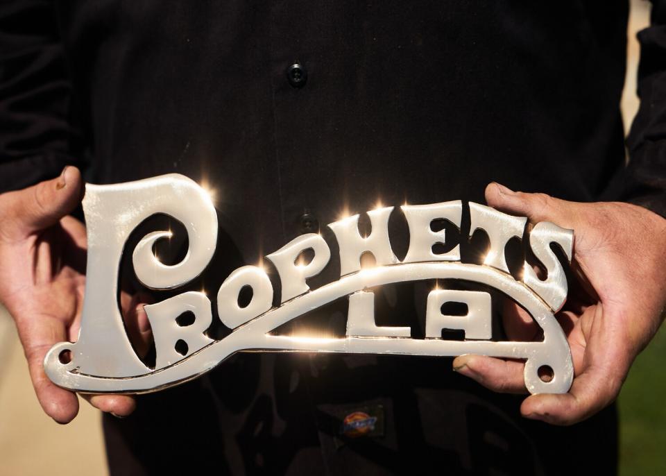 The finishing of the lowrider plaque designed by Pinche Kid. David Lopez will be finishing up the design.