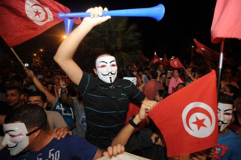 Tunisian protesters chant slogans on August 4, 2013 in Tunis in front of the Constituent Assembly headquarters