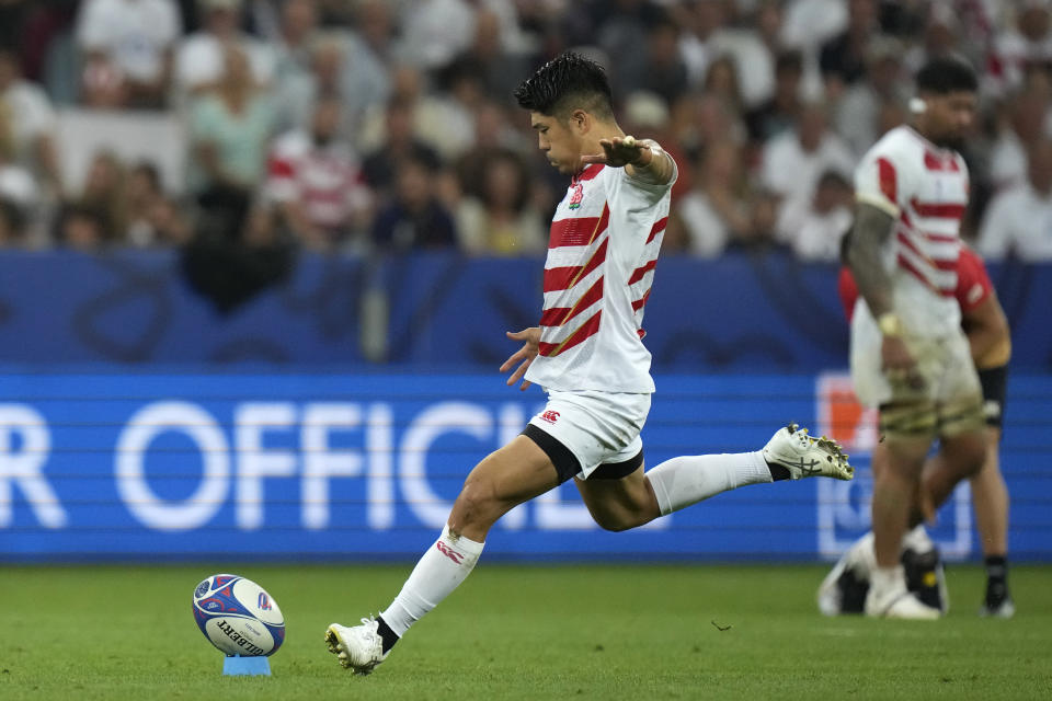 Japan's Rikiya Matsuda kicks a penalty during the Rugby World Cup Pool D match between England and Japan in the Stade de Nice, in Nice, France Sunday, Sept. 17, 2023. (AP Photo/Pavel Golovkin)