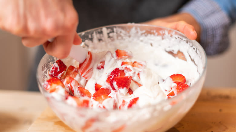 bowl of strawberries and whipped cream