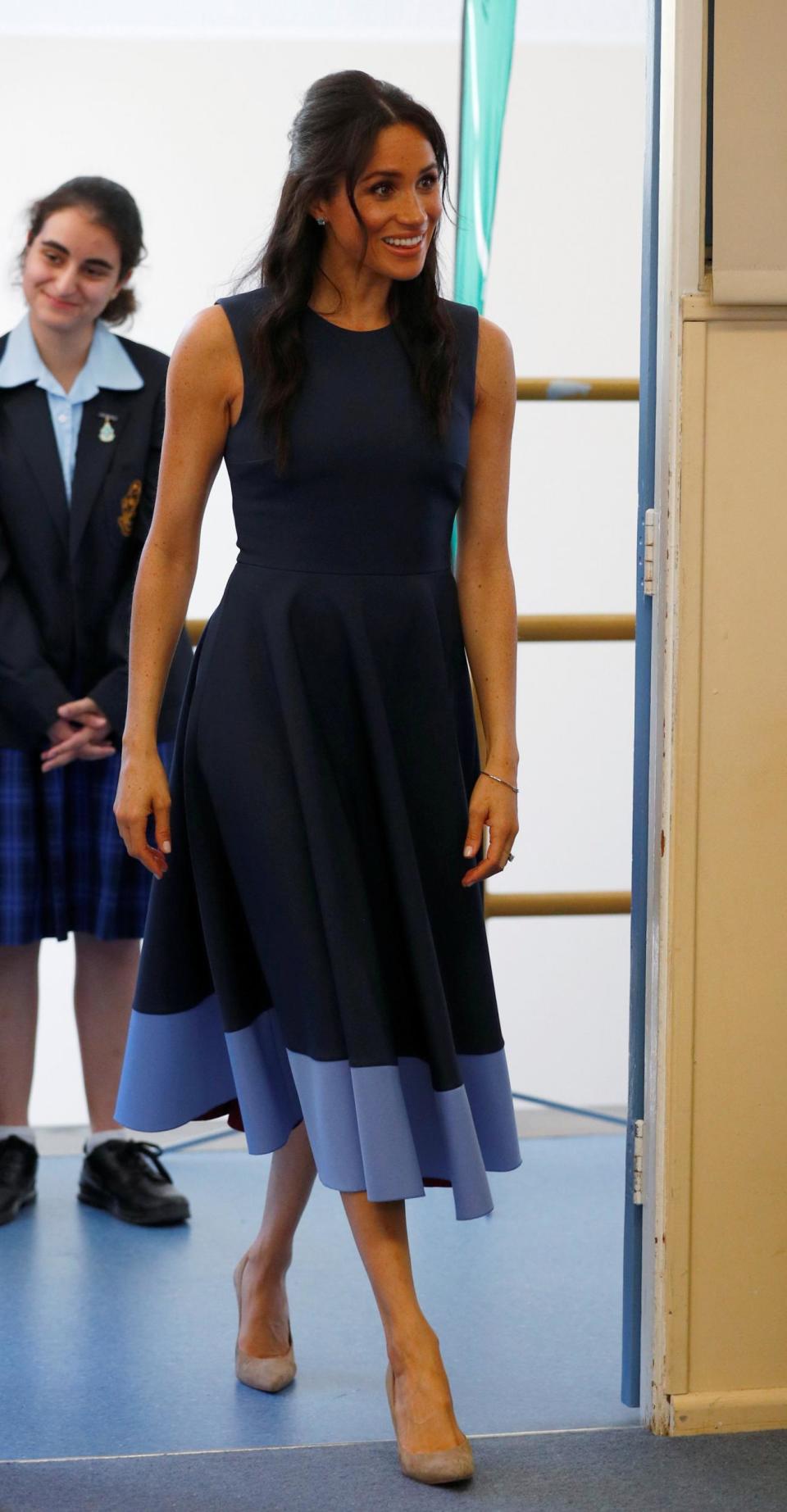 Meghan Markle arrives at Macarthur Girls High School wearing a British brand for the first time on her royal tour (Getty Images)