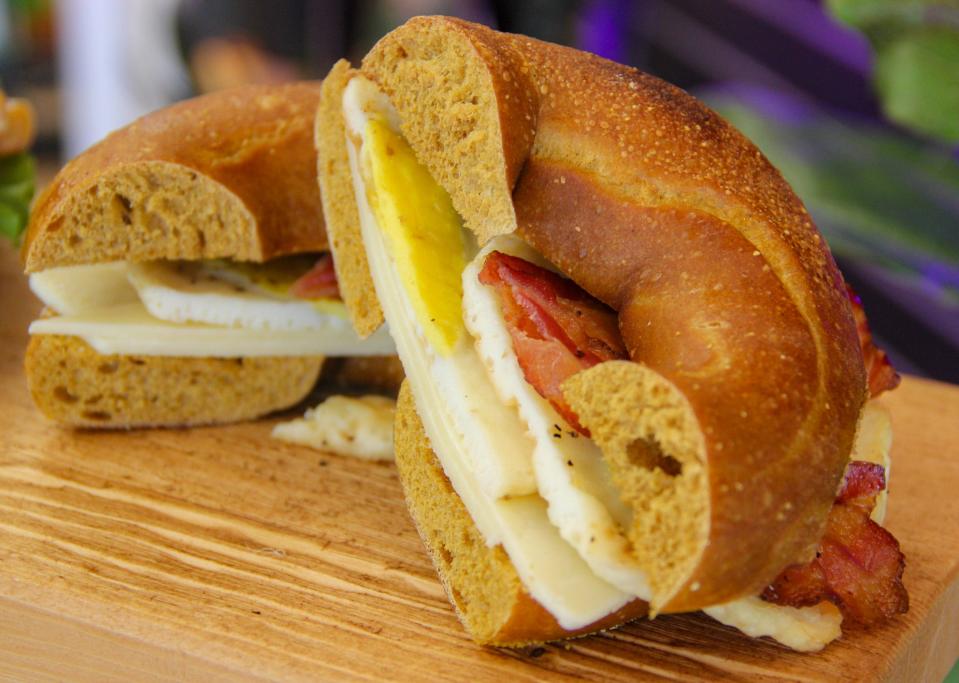 A bacon, egg and cheese sandwich is made on a French toast bagel at Rea's in Swansea.