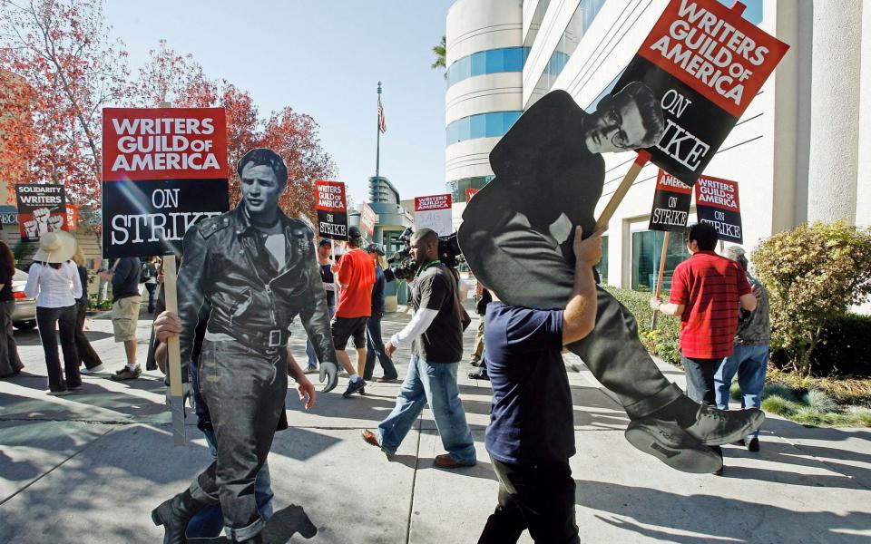 Writers previously voted to strike in 2007 - Credit: AP Photo/Damian Dovarganes, File